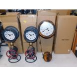 A pair of retro industrial type Quartz wall clocks, together with a pair of standing pipe wall