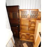 An oak laminate kitchen dresser, 182cm high, 92cm wide, 42cm deep, together with an oak veneered and