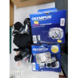 An Olympus Camedia C-5000 zoom Digital compact camera, an Olympus SP-51OUZ Digital compact camera,