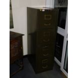 Withdrawn Pre-Sale by Executors. An early 20thC green steel filing cabinet, with brass handles