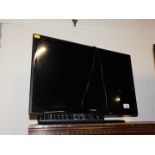 A Linsar 24" flat screen colour television, model 24LED0950S, with remote.