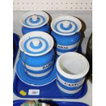 T G Green blue and white banded Cornish ware, comprising a barley jar and cover, caster sugar jar,