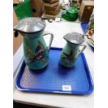 A pair of late Victorian Staffordshire pottery jugs, of graduated form with hinged pewter lids,