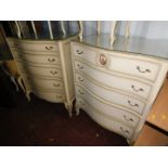 A near pair of French style cream painted chests, of five serpentine drawers, with gilt