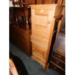A pair of pine bedside cupboards, both 66cm high, 46cm wide, 35cm deep., together with a pine