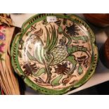 A Spanish Domingo Punter pottery bowl, decorated in green and brown with a Griffin, painted mark,