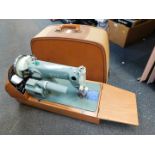 A vintage Sew-Tric Ltd Alpha electric sewing machine, model no 981269, cased.