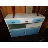 A 1960's Formica top kitchen cabinet, of three drawers, glass sliding doors and two cupboards,