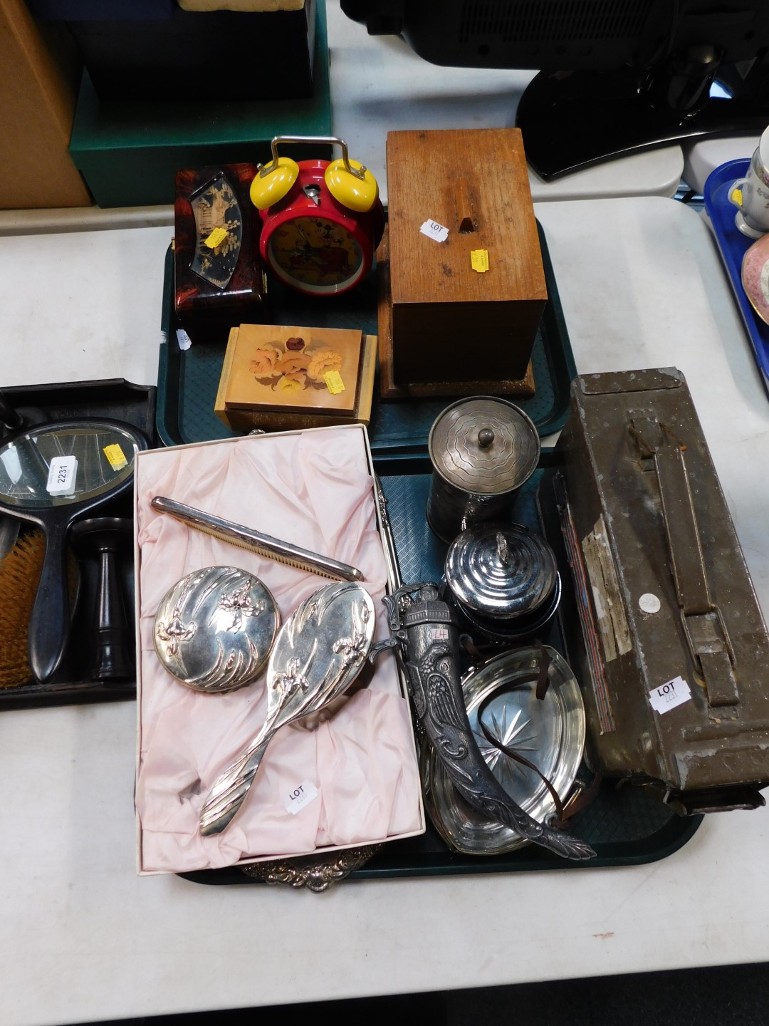 An ebony dressing table set, musical and other boxes, Walt Disney alarm clock, plated wares, and