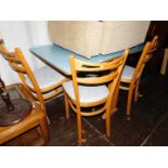 Withdrawn Pre-Sale by Executors. A 1950's blue Formica table, together with three beech chairs. (4)