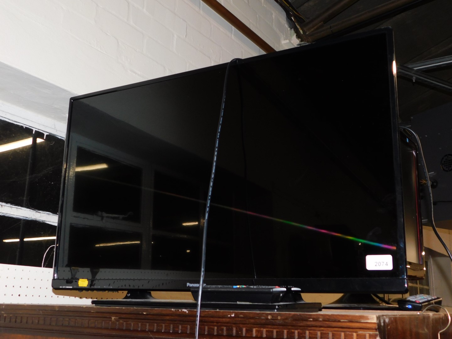 A Panasonic 32" flat screen colour television, model TX-32A400B, with remote.