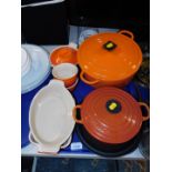 A Le Crueset casserole dish and cover, further dish and cover, open dishes, etc. (1 tray)