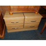 A pair of oak effect two drawer bedside chests, each 49cm high, 45cm wide, 41cm deep.