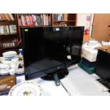 An LG 32" colour television, model no 32LH2000-ZA, with remote.