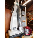 Two vacuum cleaners, a roll of House of Bath carpet, and a step ladder. (4)