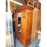 A late Victorain walnut wardrobe, with single mirror door and lower drawer, 202cm high, 129cm