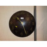 A circular shield shaped wall clock, with Quartz movement, 40cm diameter.