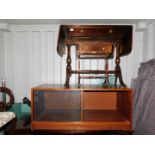 An oak veneered cabinet, with sliding glass doors, 50cm high, 118cm wide, 50cm deep., mahogany