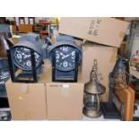 A pair of retro industrial search light type wall clocks, with Quartz movements, and two caged