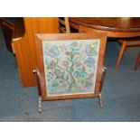 An oak framed fire screen, with tapestry style insert.