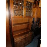 A stained oak Old Charm style bookcase cabinet, with lower drawers and cupboards, 204cm high, 92cm