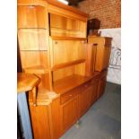 A teak lounge suite, including cupboards, sideboards and wall units. (a quantity)