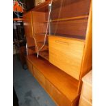 A teak lounge unit with sideboard base, 173cm high, 184cm wide, 47cm deep.