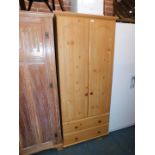 A pine effect two door wardrobe, 192cm high, 87cm wide, 56cm deep, pine bedside cabinet, tryptic