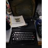 Withdrawn Pre-Sale by Executors. An Olivetti Studio Model typewriter, cased with instructions.