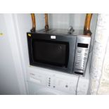 Withdrawn Pre-Sale by Executors. A John Lewis stainless steel microwave oven, model no JLFSMWC003.