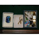 A Seiko lady's gold plated wristwatch, silver and butterfly wing brooch and further brooches,