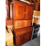 A reproduction mahogany cocktail cabinet, with upper and lower cupboards, 176cm high, 88cm wide,