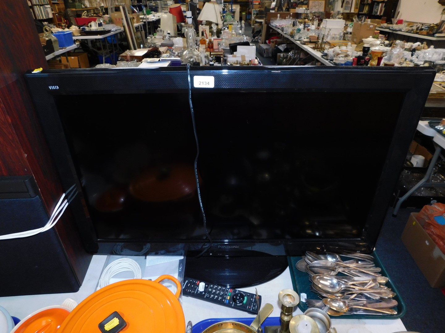 A Panasonic 32" colour television, model TX-L32X20B, with remote.