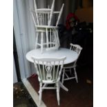 A white painted pedestal kitchen table, 75cm high, 105cm diameter., together with four painted stick