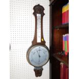 An oak cased wheel barometer, with thermometer, both presentation plaque, 74cm high.