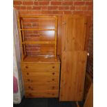 A pine effect three door wardrobe (flat pack), together with a matching five drawer chest, and a