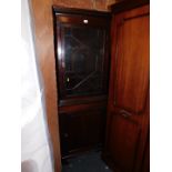An Edwardian mahogany corner display cabinet with lower cupboard, 185cm high, 70cm wide, 38cm deep.