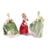 Three Royal Doulton figures, comprising Fair Lady HN2193., Christmas Morn HN1192., and Michele