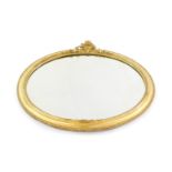 A Victorian gilt wood oval wall mirror, inset bevelled glass, 48cm high, 57cm wide.