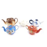 A group of teapots, comprising a Belleek Echinus teapot, Royal Worcester blue and white teapot