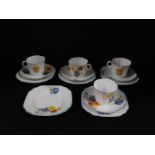 A Melba porcelain part tea service, printed with flowers, comprising four cups and saucers, and five