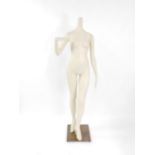 A mid 20thC cream painted female mannequin, raised on steel base, 174cm high.