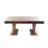 An Art Deco walnut dining table, the parquetry rectangular top raised on tapering solid vase