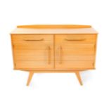 A Donald Gomme G-Plan 1950's light oak and beech sideboard, with a pair of drawers, one lined,