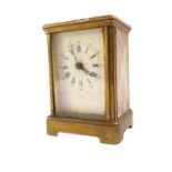 An early 20thC brass cased electric carriage clock, for Edward & Sons, Paris., rectangular enamel