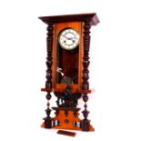 A Continental late 19thC mahogany cased wall clock, circular enamel dial bearing Arabic numerals,