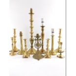 19thC and later brass candlesticks, one of gimbal form, four converted for electricity to table