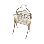 An Edwardian brass and mesh twin division magazine rack, 24cm high, 39cm wide.