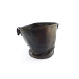 A 19thC brown leather bucket with strap handle, 35cm high.