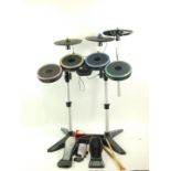 A Playstation drum kit, complete with drumsticks and two foot pedals. (4)